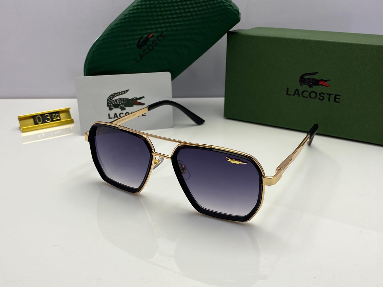Lacoste Hex Sunglasses – Gold Frame | Gradient Black Lenses | Signature Emblem